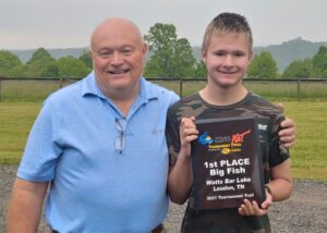 Jordan is shown here with his dad, proudly holding his Big Fish award from the King Kat tournament on Watts Bar. 