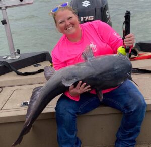Whether blues or flatheads, big catfish make Amy smile. And you can be sure she is willing to talk to you about her catches. 