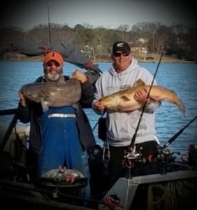 Aaron Wheatley and Rusty “Frog Legs” Morris on the Cumberland River with 50-pound and 27-pound blue catfish. 