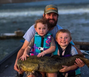 Tyler Richards is shown here with both his boys, Reed (right) and Rhett who just turned two years old and can already cast a full-size spinning reel.