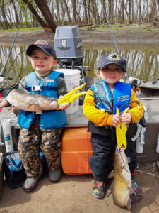If Reed has his preference he would rather fish on rivers. He is shown here with his two-year-old brother, Rhett, and a couple of nice channel cats from the Rock River in North-Western Illinois.