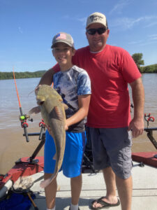 Gabe Staggs shows off an Ohio River flathead he boated on a weekend fishing trip with Chris Souders.