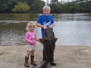 Blake Sasser and his younger sister Macie are posing here with Blake’s 36.9 pound flathead. (Submitted Photo)