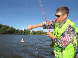 Michael Haney is shown here with his Flathead Fever Dragging Chub rig. When the bite is slow on anchor he and Crimm often turn to dragging baits. 
