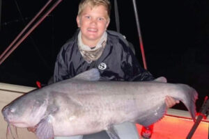 photo of Charlie holding a catfish