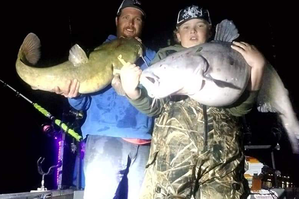 Nathan and Joshua increased their catfishing skills, bigger fish came to the boat. They are shown here with a nice trophy blue cat as they continue their catfish journey.