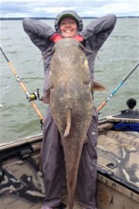 Demetria is drawn to catfishing because of the mystery of not knowing how big a fish might be. In this case, she discovered a 62-pound flathead on the end of her line in the Tennessee River. (Submitted Photo)