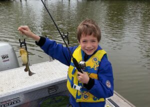 All of Chris’s boys have joined him on the water at one time or another. Photos like this bring back memories of his childhood. It features his youngest son Dustin with a yellow belly.  