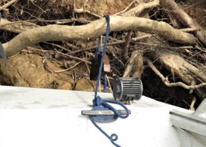 A key piece of equipment for tying securely to the shoreline is weighed throw lines. The weight is thrown over a suitable limb or behind a rock and the boat is pulled up tightly to the shore. 