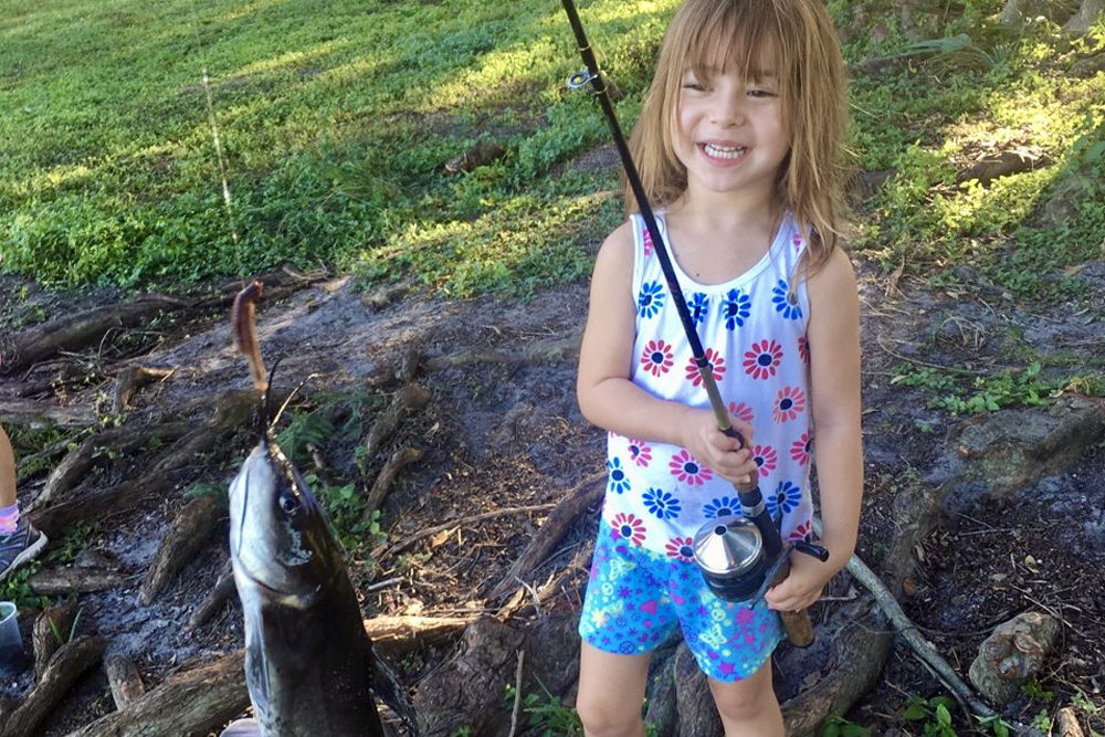 Channel catfish catches bring on plenty of smiles at the MLK Jr Park Pond in Winter Park, FL.