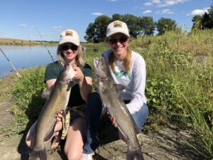 Ted Ellenbecker says days like this, when his daughters Jori (left) and Jaydin are successful, are his best days, even when he doesn’t catch a catfish himself.