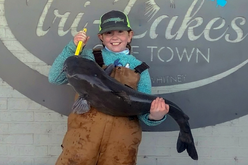 Credit Texas Parks & Wildlife) Congratulations to 9-year old Maggy Sojourner on a new Junior Waterbody record with her 26-pound-plus blue catfish from Lake Granbury, Texas.