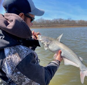 Jordan Leer took a moment to admire one of the blue catfish he caught on a spring fishing trip at Truman Lake.