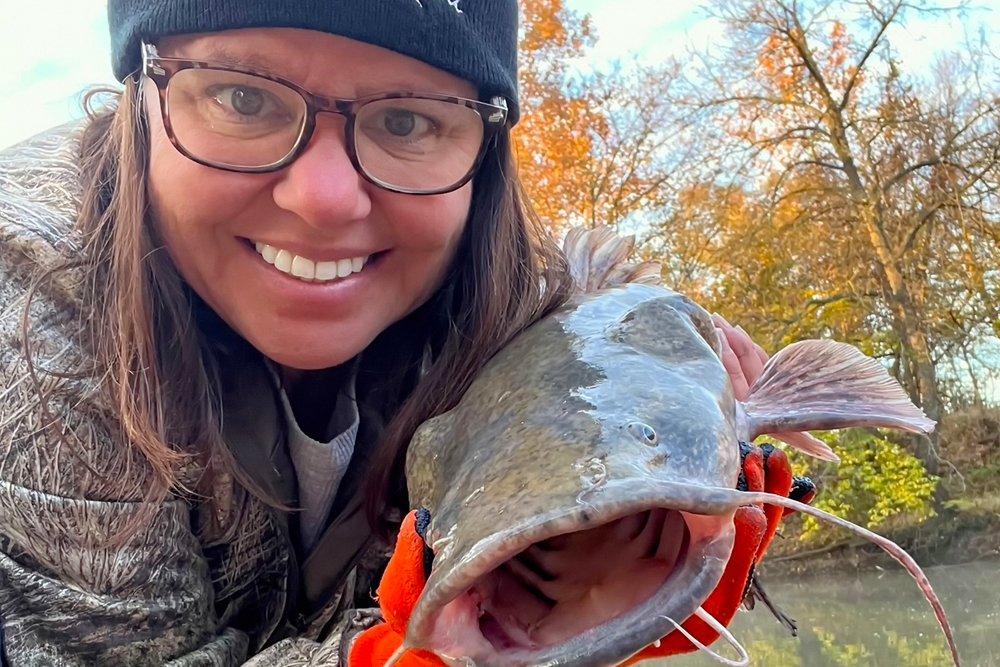 Catching flathead catfish out of her kayak always brings a smile to Mary Kay Myers’ face.