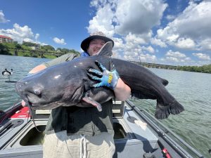 Capt. Mike Mitchell of SouthernCats Guide Service, occasionally uses a light-tackle technique. He says James Paul from Birmingham reeled in this huge 61-pound blue on spinning tackle and 10-pound test Slime Line. (Photo: Capt. Mike Mitchell)