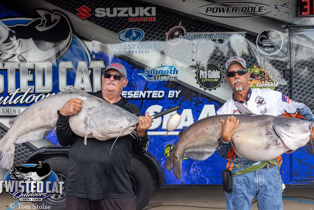 John Jamison (left) and Kevin Parks had their hands full after winning a Twisted Cat Outdoors tournament July 22 on the Mississippi River.