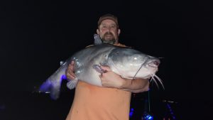 Chad Mayfield fishes at night to catch giant blue cats on Wheeler Lake in Alabama.