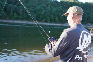 Attaching a smartphone to a fishing pole allows an angler to see the sonar or mapping imaging while fishing.