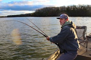 Capt. Aaron Massey cranks down on a Tennessee River catfish that took the bait on Dec. 15, 2022.