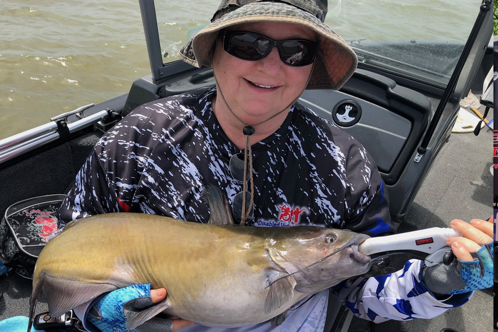 U.S. Air Force veteran Beth Seeman caught several catfish during the 2024 catfish outing with Disabled Veterans Outdoors in Sandusky Bay in Ohio.