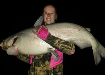 Morgan is shown here with her PB 44.7-pound blue cat. No more pay lakes for her. She caught this beautiful blue on the Kanawha River.