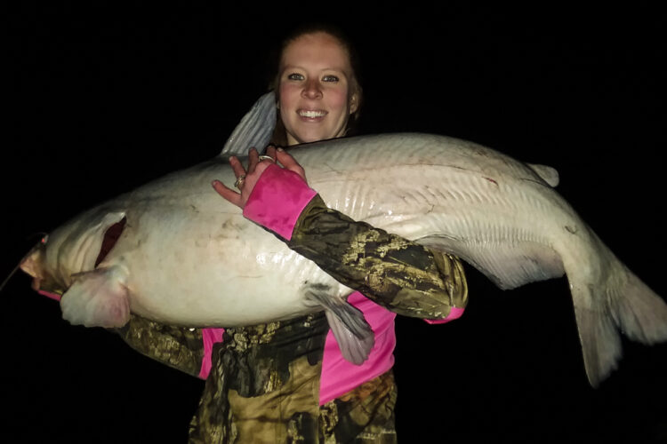Morgan is shown here with her PB 44.7-pound blue cat. No more pay lakes for her. She caught this beautiful blue on the Kanawha River.