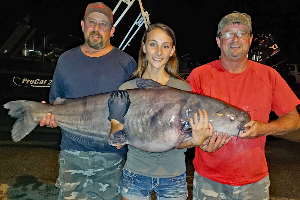 Brooke Mayfield shows off a trophy blue caught fishing one of the many tournaments she fished with her Dad, Chad Mayfield (left), and friend, Jeff Helms (right). (Contributed Photo)