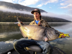 After his father broke the incredible 100-pound-plus barrier on the first fish of the day, Woody Cabe repeated the amazing feat on their last fish of the day with this 102-pound beastly blue. (Photo: Ty Konkle)