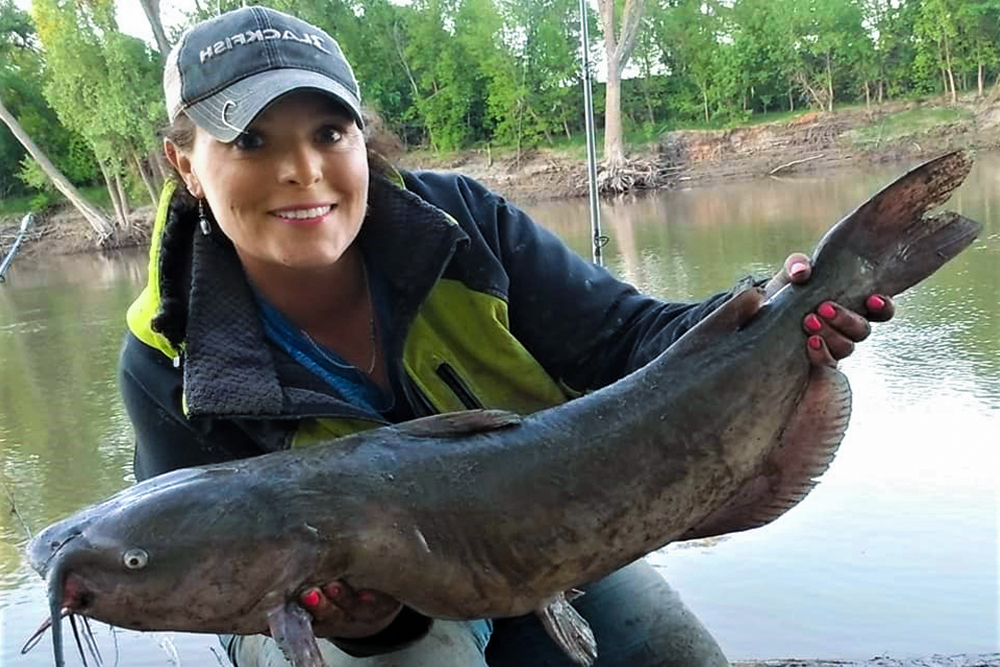 Photo of Christina Lemke holding a nice catfish