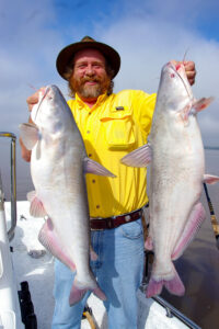 Author Keith Sutton with a pair of nice blues caught while bumping on the Mississippi River near Memphis. (Keith Sutton Photo)