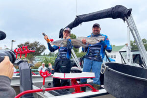 Greg and Gabe Staggs in the weigh-in line during the Grassroots division of the Twisted Cat New Madrid tournament.