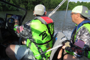 ichael Haney and Rodney Crimm riding in a boat