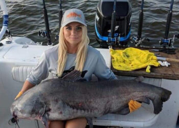 Tiffany “Snookie” Risch landed this 72.8 pound monster blue catfish in July of 2018 while fishing cut baits on the James River with Captain John Garland.