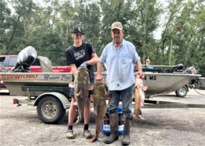 The winning team at the Bad Cat Classic was Travis Rushing and his grandson Trey. They are shown here with the three nice flatheads that gave them the win. 