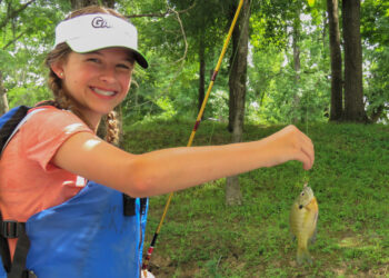 photo of Lilly holding a fish