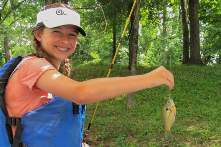 photo of Lilly holding a fish