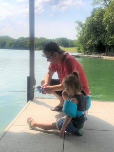 Avery fished with her dad, hoping to catch a big one. (Brent Frazee Photo) | Cattin' With Grandkids