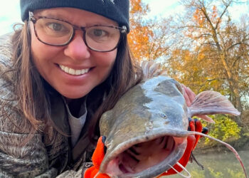 Catching flathead catfish out of her kayak always brings a smile to Mary Kay Myers’ face.