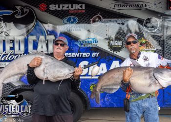 John Jamison (left) and Kevin Parks had their hands full after winning a Twisted Cat Outdoors tournament July 22 on the Mississippi River.