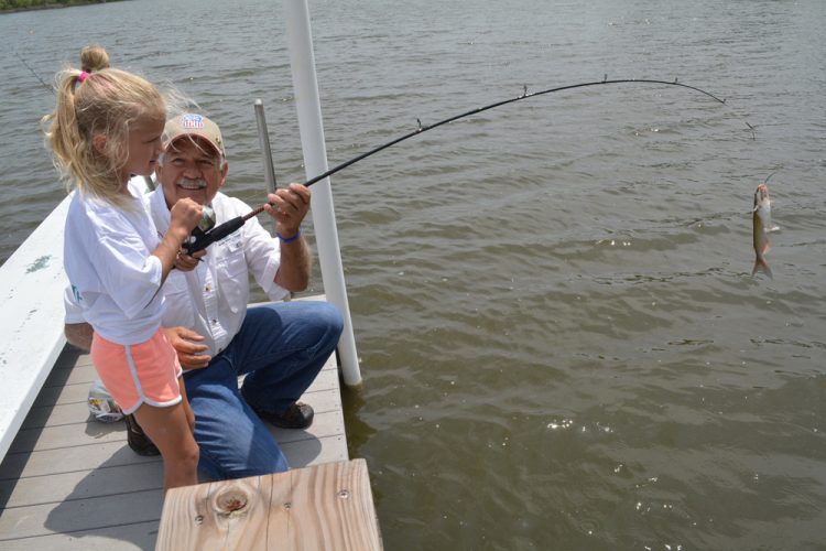 Little catfish bring big smiles to young anglers who participate in special mentored fishing events.