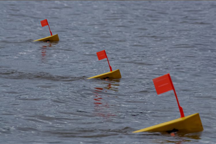 More and more catfish anglers are employing planer boards like those from Off Shore Tackle to improve their fishing success.