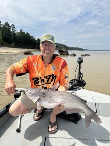 B ‘n’ M Pro Staff member Rodney Crimm displays a blue cat he caught on Grenada on a trip last year. Crimm caught the cat on cut skipjack.