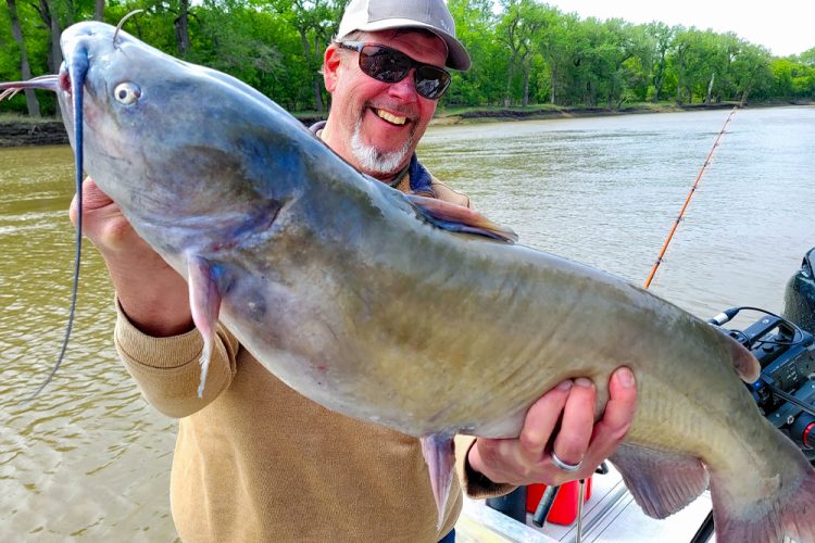 TV host Chad Koel holds a channel catfish that dreams are made of. It is a fish like this that sets expectations high, especially when it is on a television show.