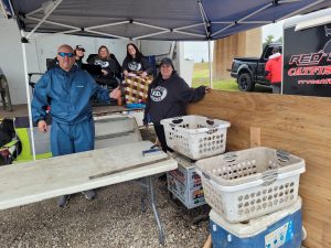 The women of the weigh-in crew and Mark Aitchison, a long-time volunteer at the Scheels Boundary Battle. It was very windy and wet, yet the crew prevailed.