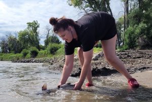 Madi Estad releasing a fish after weigh-in