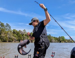 Lindsey Brown hoists a feisty blue into the boat on Santee Cooper, her home away from home for catfishing.