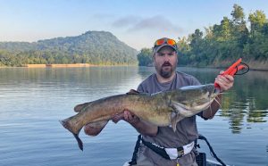 On the Cumberland River, very near downtown Nashville, Tenn., barges often sit moored along the river’s edge. Lade Conlee routinely fishes beneath the shade of those barges for big flatheads, including his personal best. (Photo by Mike Bombardieri)