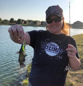 Caption: Austin Dollar is proud at his catfish catch at the neighborhood pond near his home in Denton, Texas. (Photo by Holly Dollar)