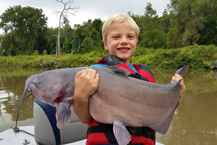 Braden Durick, the author’s son, in 2016 when he was six years old. This was the day Braden discovered that catfishing is amazing.
