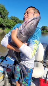 Sometimes kids must strain to handle big catfish, and photos like this provide memories of the battle